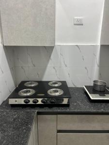a stove top oven sitting on a kitchen counter at north eye in Noida