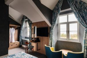 a hotel room with a bed and a window at Craig Manor in Bowness-on-Windermere