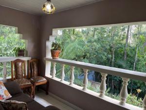 a living room with a large window and a couch at Lifeline Homes in Kiserian