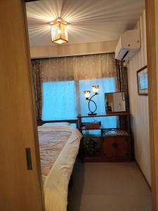 Giường trong phòng chung tại 源氏民宿