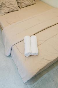 En eller flere senge i et værelse på Haura By Travelink