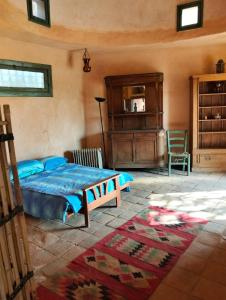 a bedroom with a bed and a dresser at Chalet besides sakkara piramid in Cairo