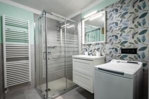 a bathroom with a shower and a sink and a mirror at Seconda stella a destra in Valgrisenche +69 photos