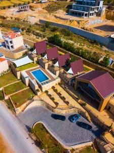 an aerial view of a building with a swimming pool at La Madera Resort in Turbul