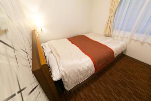 Postel nebo postele na pokoji v ubytování Hotel New Ueno