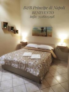 En eller flere senge i et værelse på Il Principe di Napoli