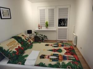 En eller flere senge i et værelse på Apartament Max