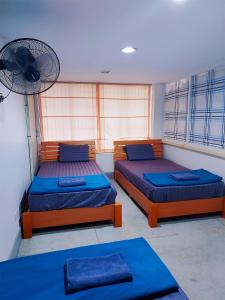 Postel nebo postele na pokoji v ubytování KingSun HOSTEL 金珊旅馆