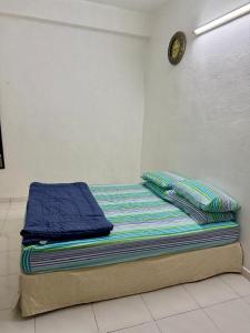 Postel nebo postele na pokoji v ubytování Cozy Home near Airport, & Bayan Lepas Industrial