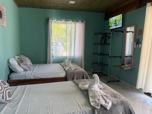 Postel nebo postele na pokoji v ubytování cabina DiTi 2