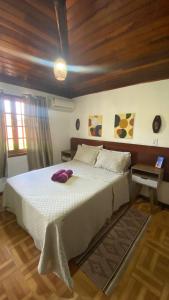 En eller flere senge i et værelse på Casa de Temporada Centro Búzios