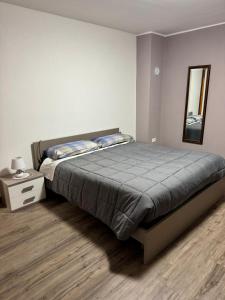 En eller flere senge i et værelse på Appartamento della Nonna