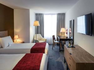 En eller flere senge i et værelse på Mercure Montevideo Punta Carretas + 61 billeder