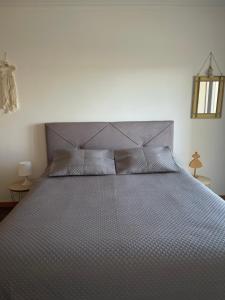 En eller flere senge i et værelse på GARDEN & BEACH HOUSE