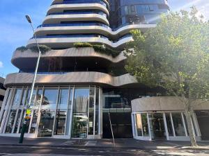 a tall building with a tree in front of it at Prospect Box Hill - Magnificent View 2B1B in Box Hill