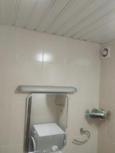 a bathroom with a mirror and a toilet in a room at APARTMENT, PLJEVLJA, NEW BUILDING 71 m2 in Pljevlja +4 photos