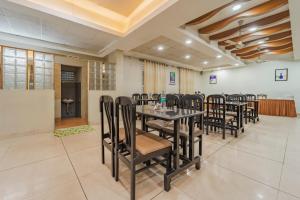 a conference room with a table and chairs at Treebo Akshaya Palace Inn in Mysore