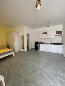 a large room with a kitchen and a living room at Magawish Hurghada Studio 7 in Hurghada