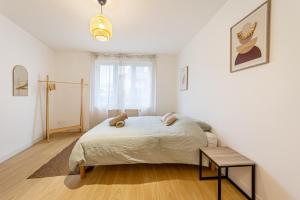 En eller flere senge i et værelse på L'Armonia en plein centre de Mordelles