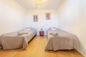 En eller flere senge i et værelse på L'Armonia en plein centre de Mordelles