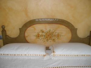 Postel nebo postele na pokoji v ubytování B&B I fiori di Marianna