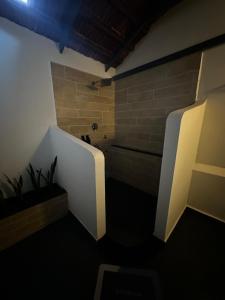 a bathroom with a bath tub in a room at Sky Holiday Homestay Cottages Madikeri Kushalnagar Coorg in Kushālnagar