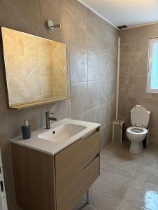 Et badeværelse på Appartement au porte de Geneve