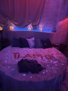 a bedroom with a purple bed with flowers on it at Tecaia Secret Luxury Suite in Formia
