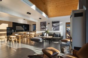 a living room with a table and chairs at APARTAMENT No 1 MOUNTAIN VIEW Sauna Priv okolice Zakopane Czorsztyn Kluszkowce in Kluszkowce