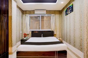 En eller flere senge i et værelse på Collection O Gold Valley Formerly Misty Royale + 29 billeder