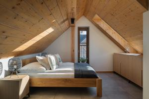a bedroom with a large bed with a wooden ceiling at APARTAMENT No 1 MOUNTAIN VIEW Sauna Priv okolice Zakopane Czorsztyn Kluszkowce in Kluszkowce