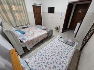 En eller flere senge i et værelse på Casa Amarela + 6 billeder