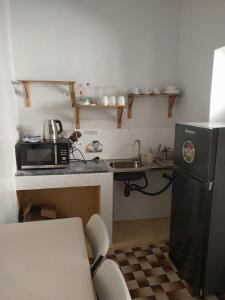 Kuchyň nebo kuchyňský kout v ubytování Sol, Terra e Mar- No coração do Plateau