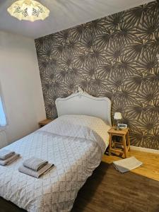 En eller flere senge i et værelse på Maison avec grand jardin clos