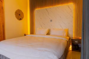 เตียงในห้องที่ Inyoni Boutique Hotel and Restaurant