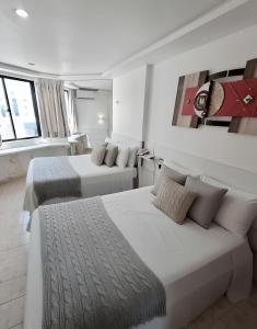 En eller flere senge i et værelse på Apto em Intermares 2 Camas Casal #VF510 + 23 billeder