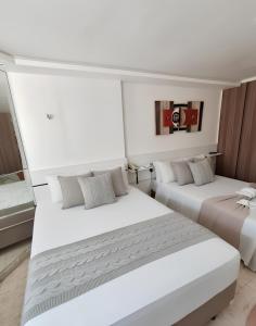 En eller flere senge i et værelse på Apto em Intermares 2 Camas Casal #VF510