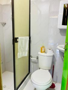 a bathroom with a toilet and a shower at cabaña hotel oasis in Montenegro +61 photos