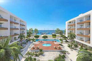 an aerial view of a resort with a swimming pool at Prince Delmar Waterfront Olhao by Junto ao Mar in Olhão