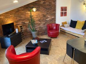 Et tv og/eller underholdning på L'atelier du faubourg