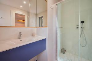 a bathroom with a sink and a shower at Casa Ponente in Porto Santo Stefano +22 photos