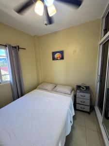 En eller flere senge i et værelse på Cielo Alto