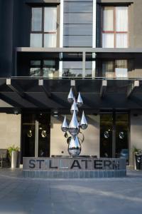 a building with a sign in front of a building at Stillaterm SPA in Mineralni Bani