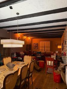 a dining room with a table and chairs at Villa Naum in Voskopojë