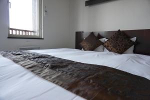 Postel nebo postele na pokoji v ubytování Chalet Fuyuri