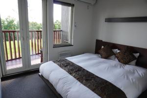 Postel nebo postele na pokoji v ubytování Chalet Fuyuri
