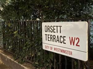 a sign that reads urgent terrace on a fence at Fantastic Two Bed Flat In Paddington Central London Zone 1 in London