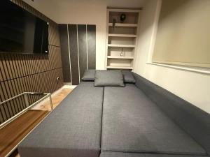 a large bed in a room with a tv at Fantastic Two Bed Flat In Paddington Central London Zone 1 in London +14 photos