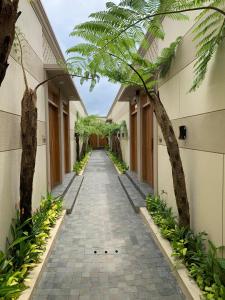 an empty hallway of a building with trees at Kamaya Villa Jogja in Ngaglik