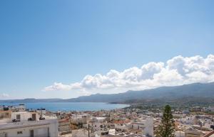 a view of a city and a body of water at Mira Sitia Luxury Apartment in Sitia